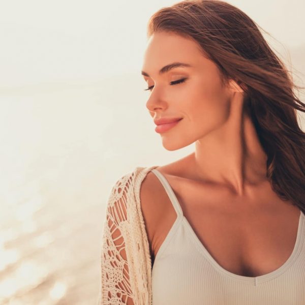 Portrait of attractive dreamy cheerful long-haired girl spending day weekend freh air life at beach outdoors